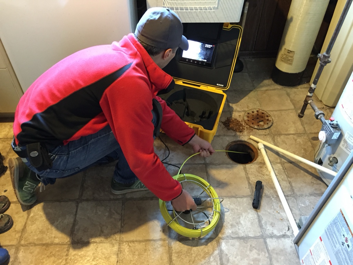 Drain camera inspection equipment being used on a plumbing line